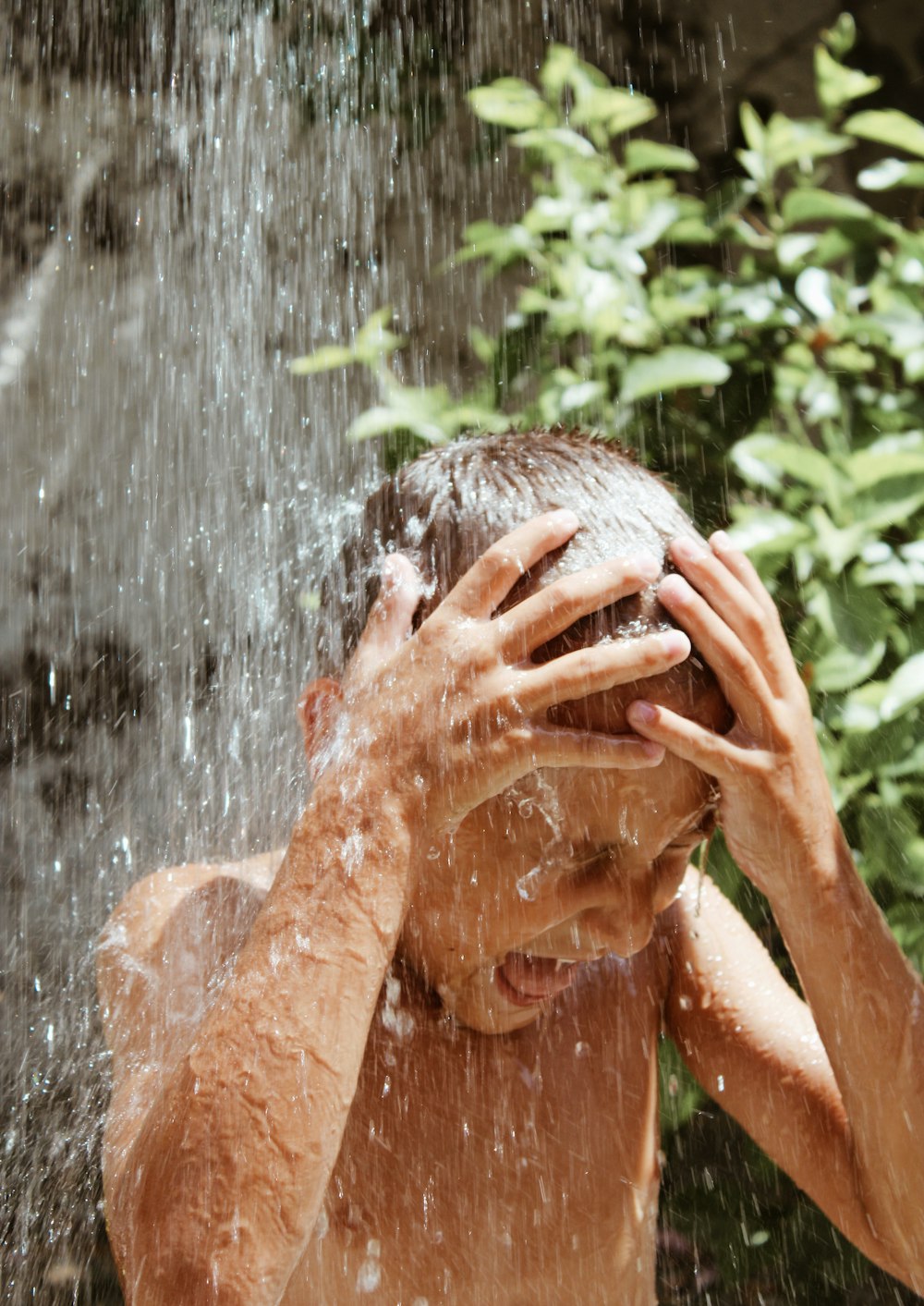 person holding water fountain during daytime