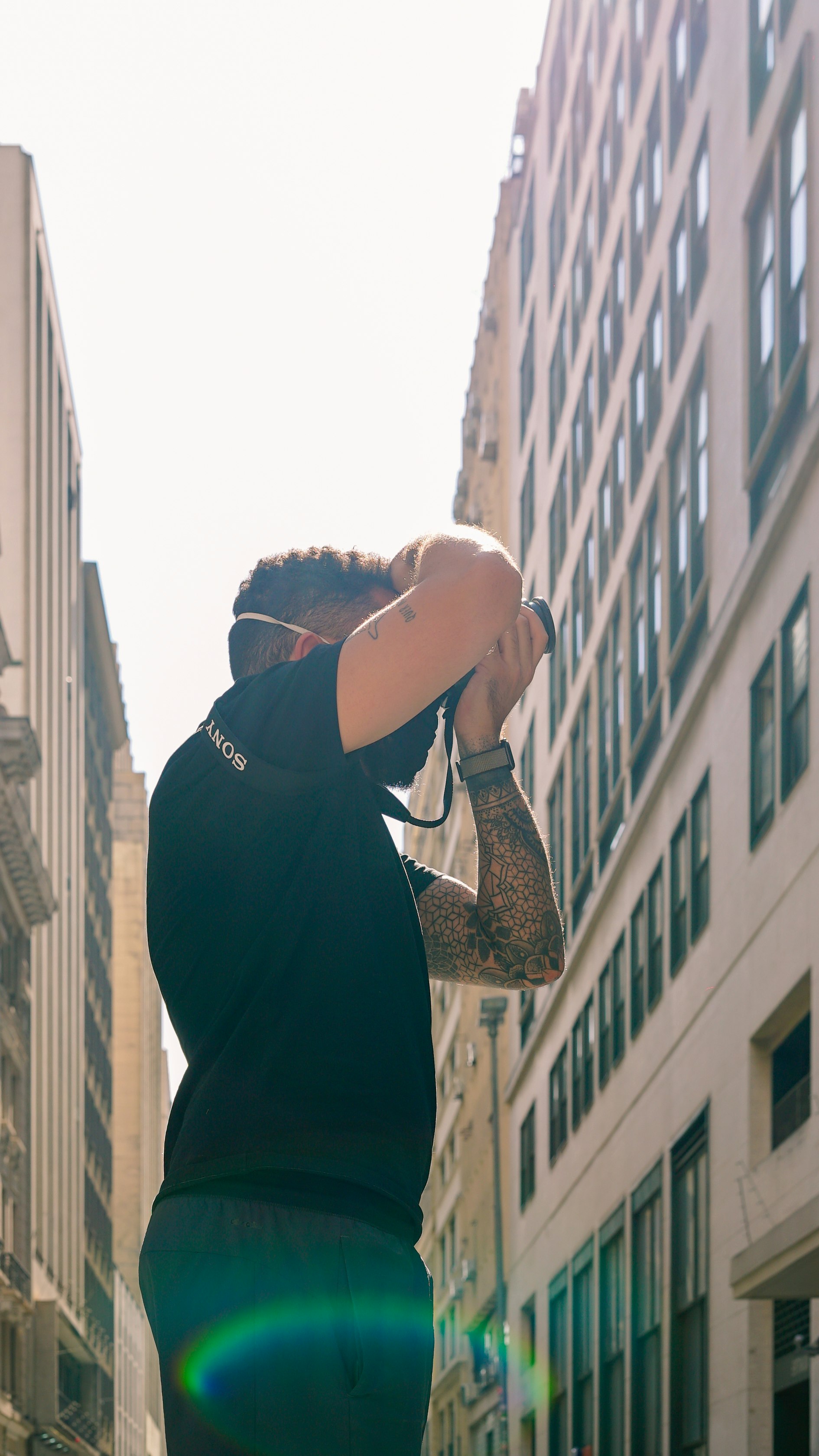 man in black jacket holding smartphone