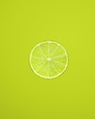 yellow lemon fruit on green background
