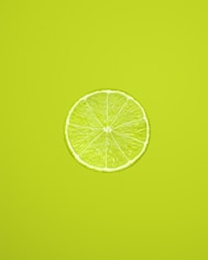 yellow lemon fruit on green background