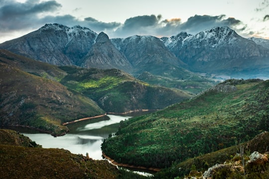 green and gray mountains near lake during daytime in Elandskloof South Africa