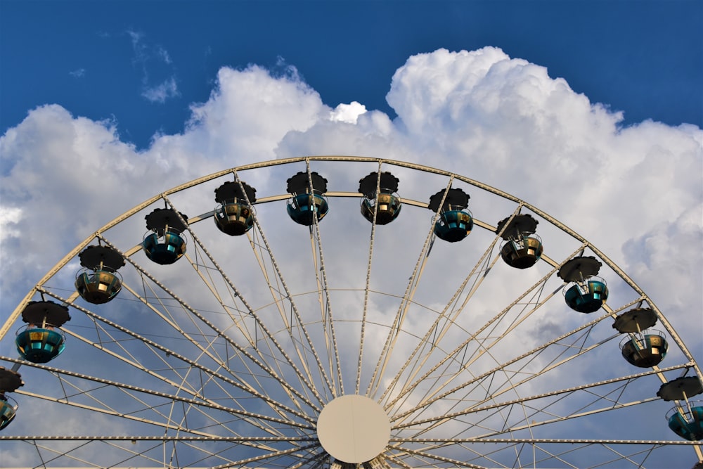 white ferris wheel under blue sky during daytime