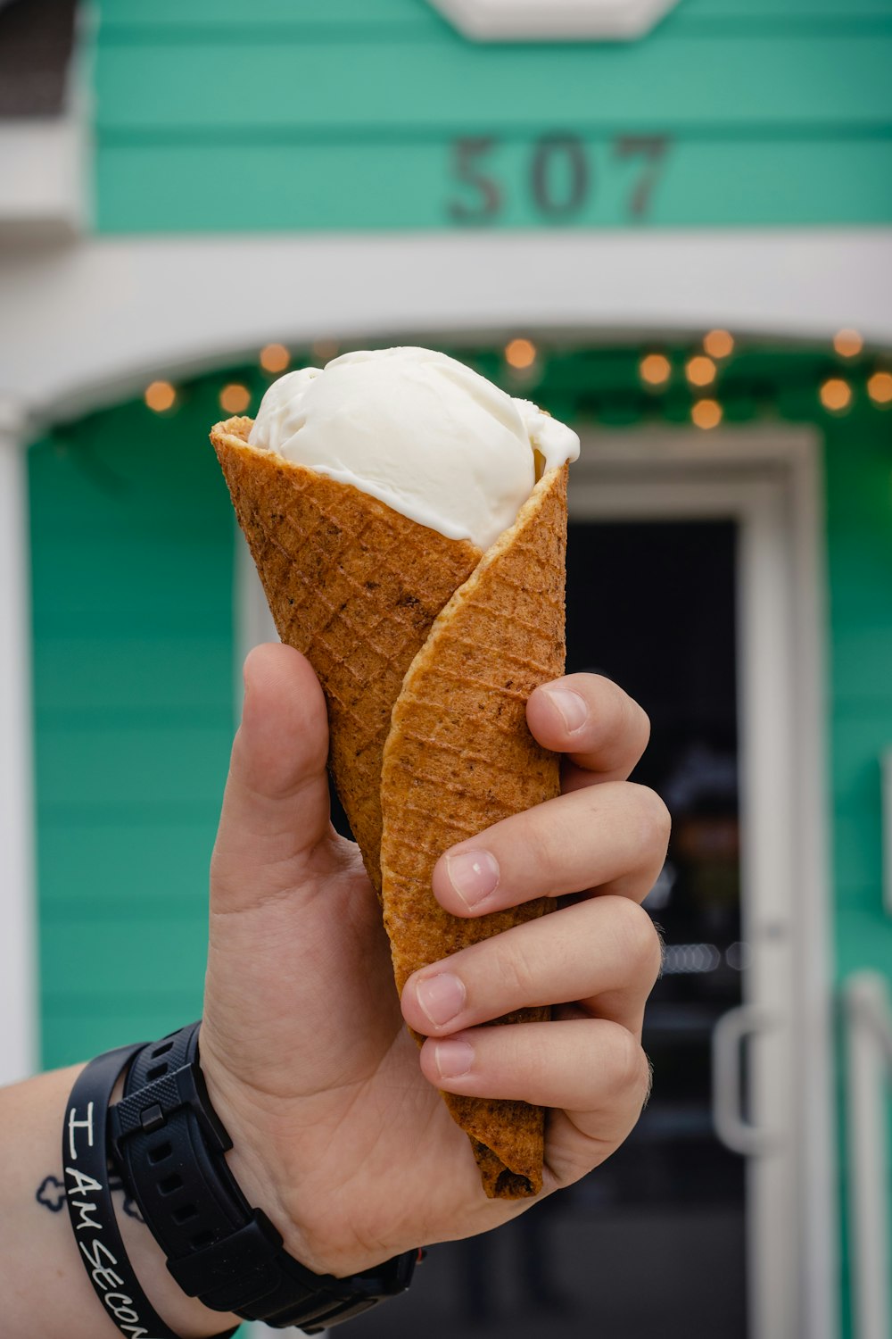 person holding ice cream cone