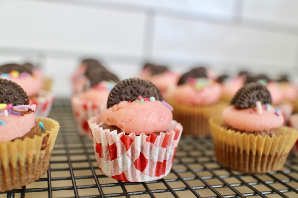 cupcakes on black metal rack