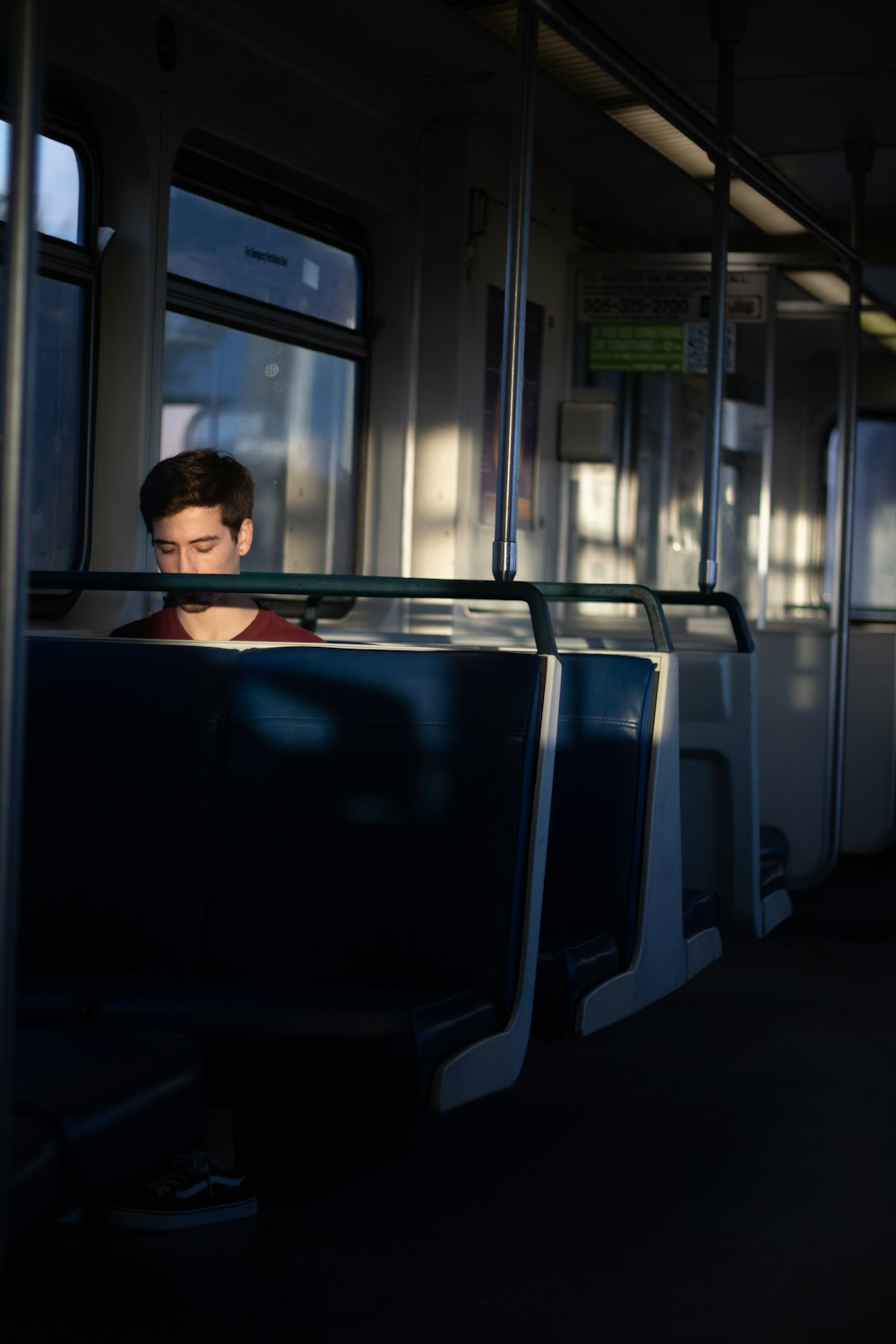 woman in black shirt sitting on bus seat