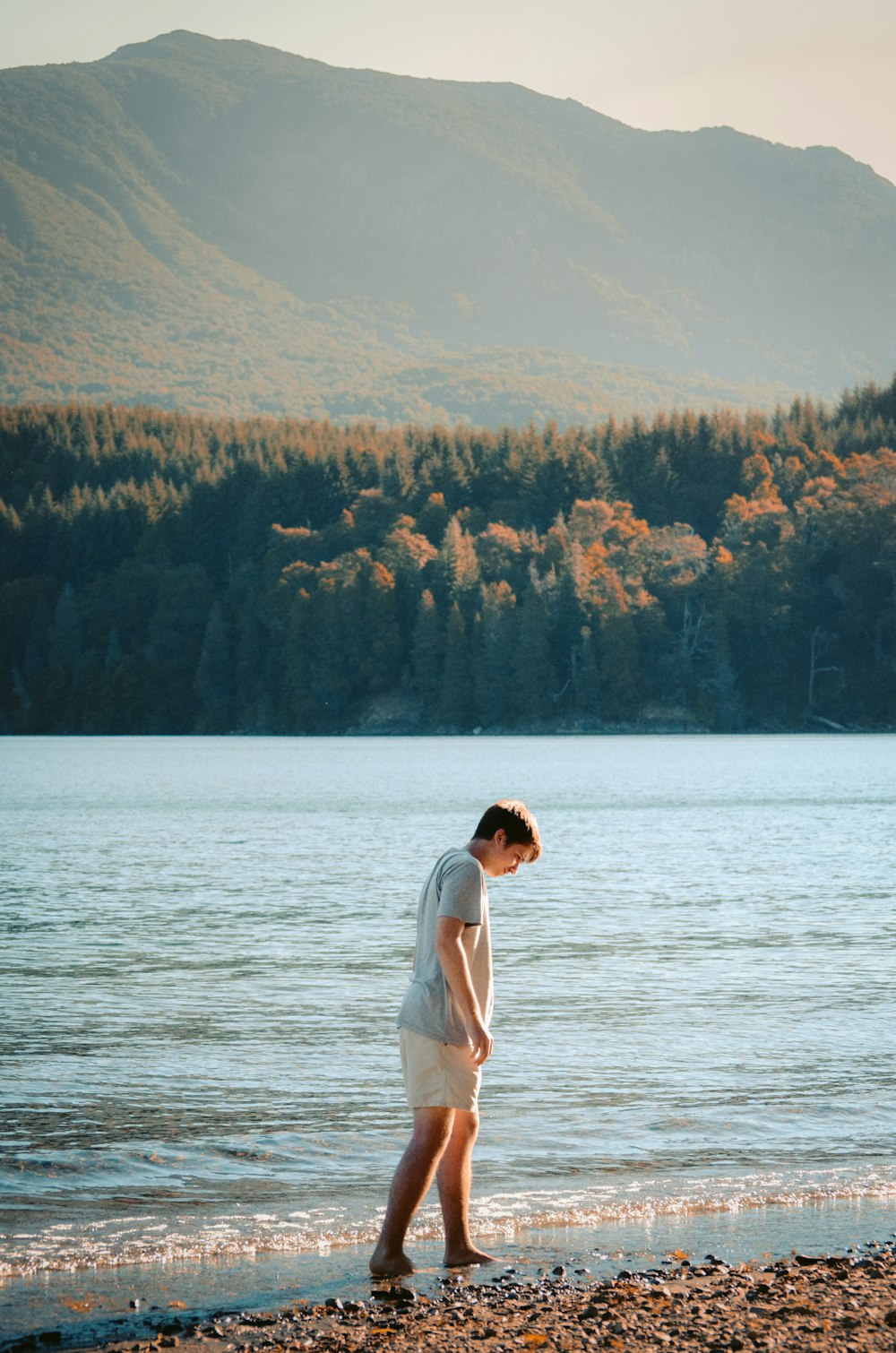 woman in white dress standing on snow covered ground during daytime