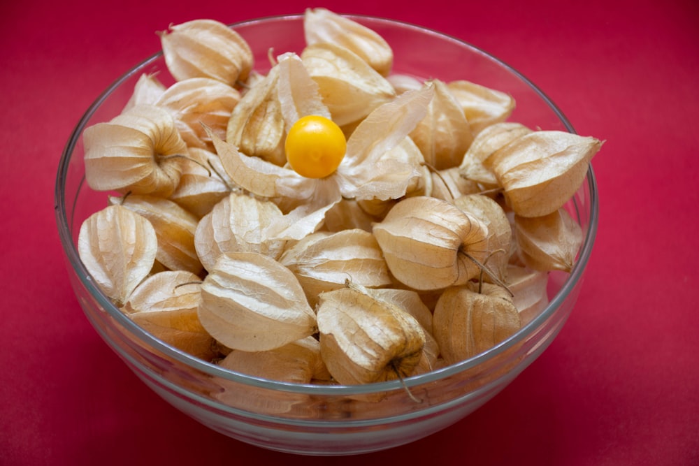 clear glass bowl with yellow and pink candies