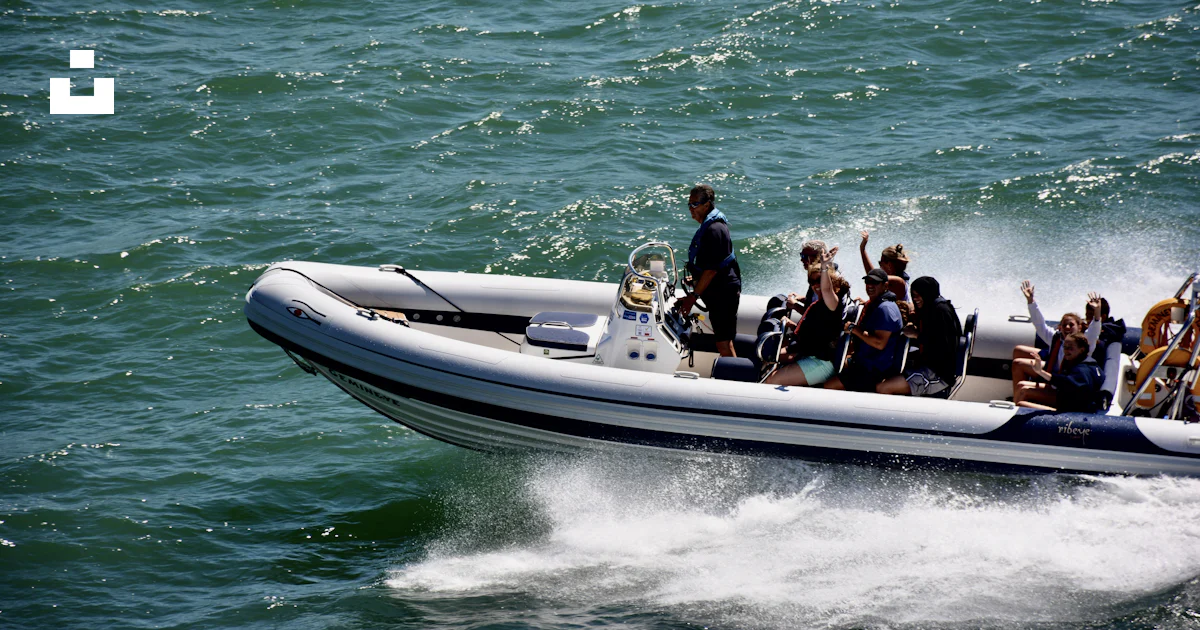 People riding on white and black speed boat on sea during daytime photo ...
