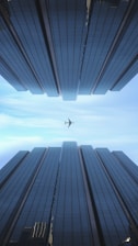 an airplane flying through a very tall building