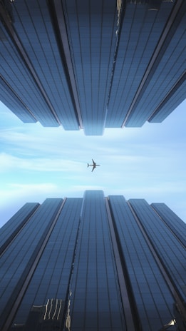 an airplane flying through a very tall building