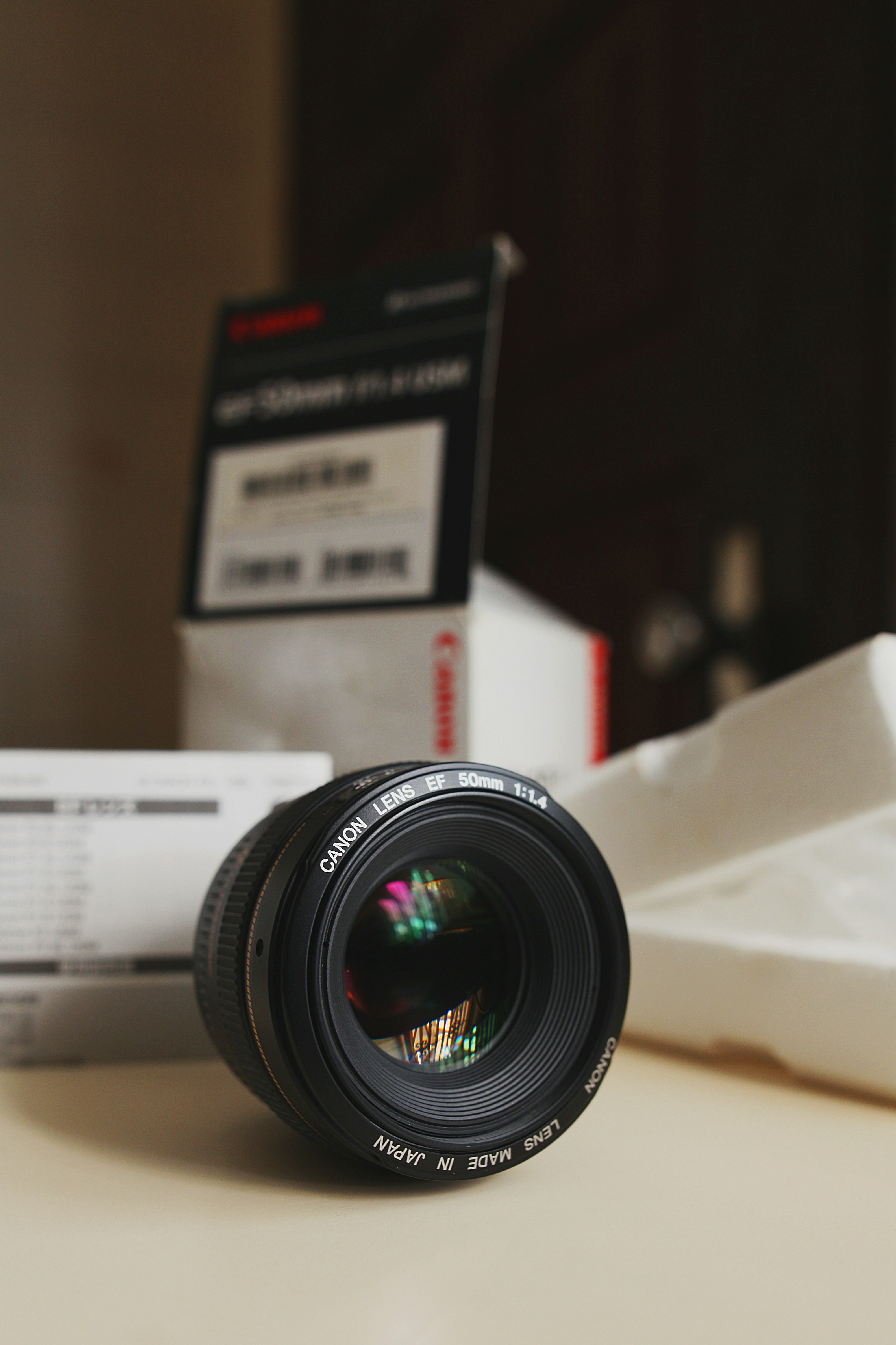 black and silver camera lens on white paper