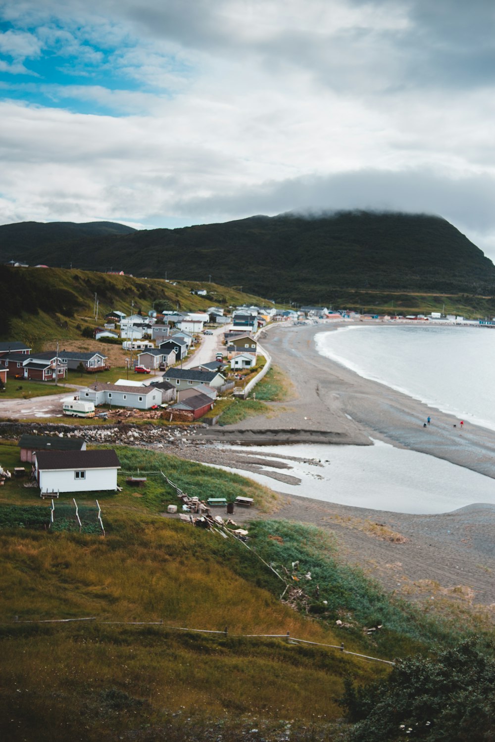 houses near body of water during daytime