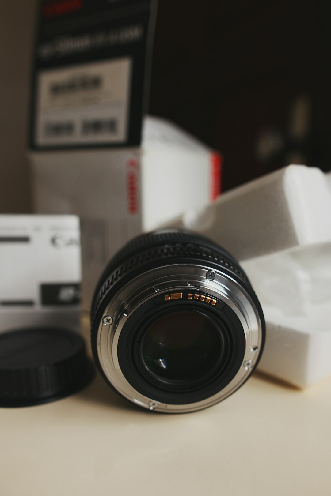 black nikon camera lens on white box