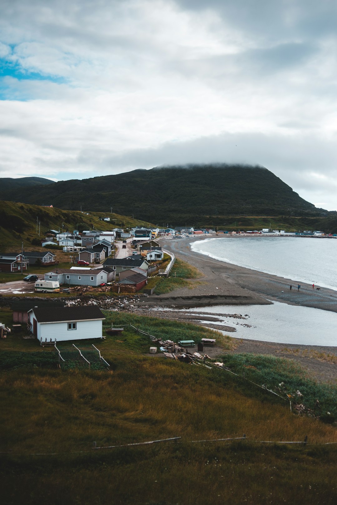 houses near body of water during daytime