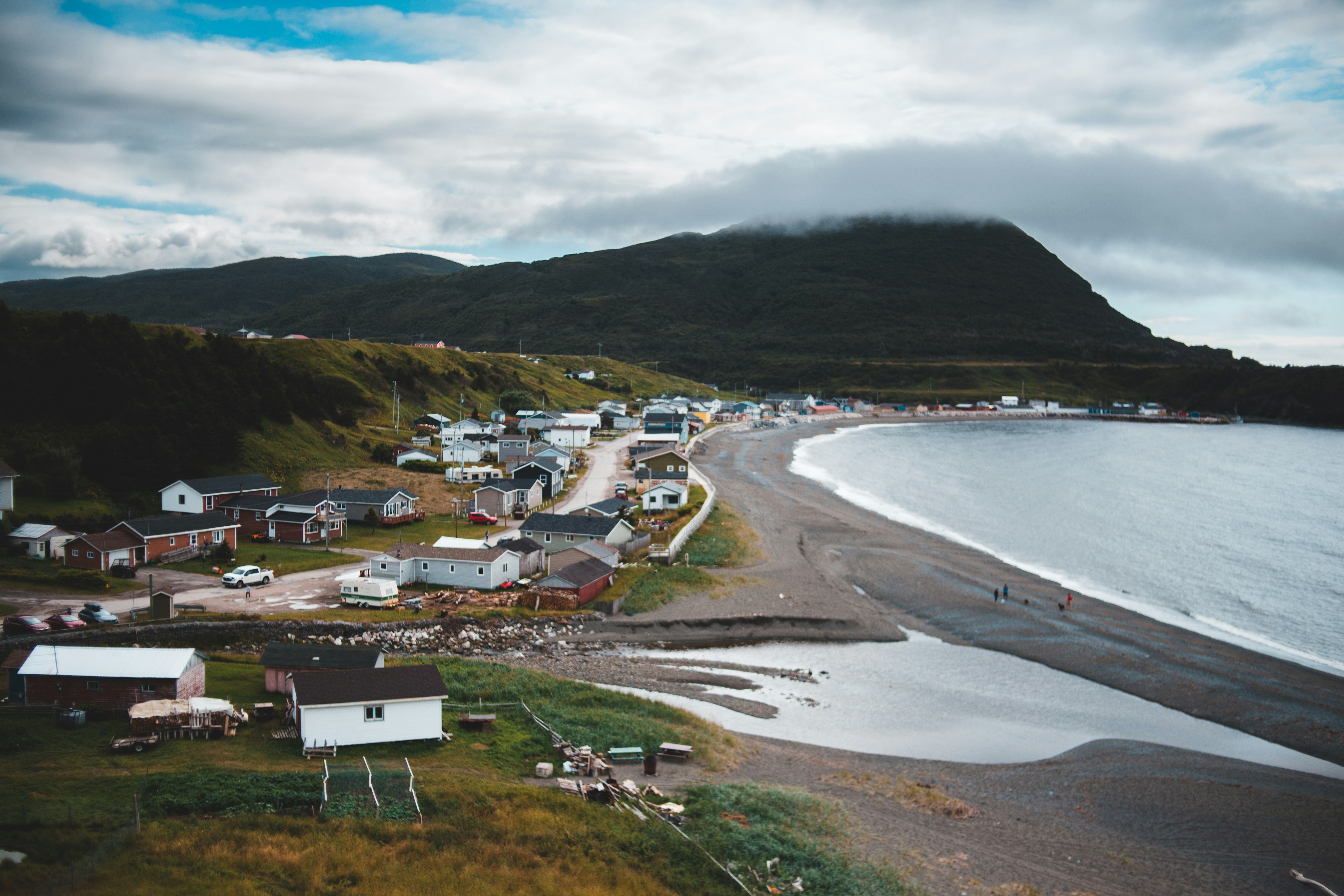 houses near body of water during daytime