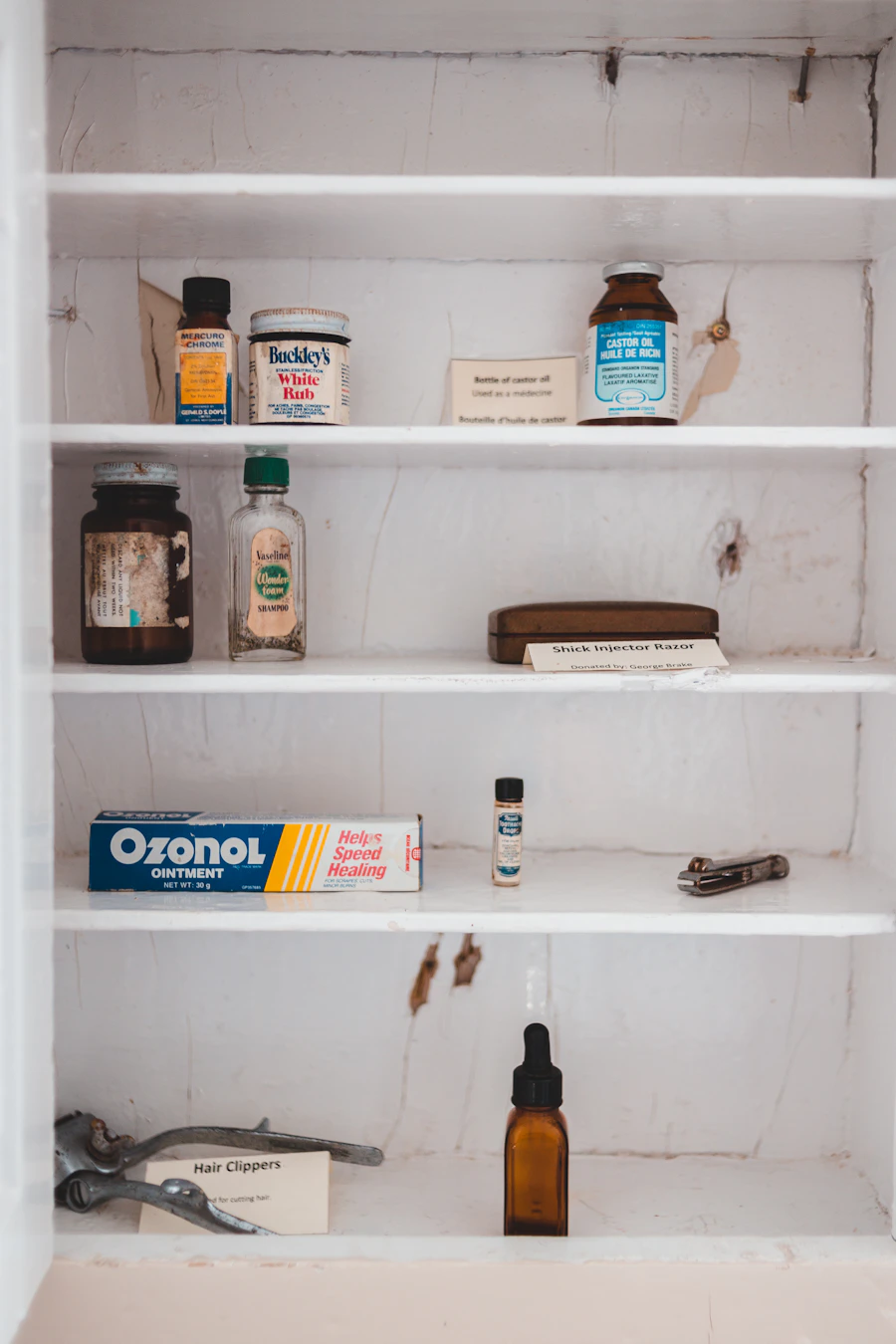 Shelf of salon hair care product bottles including shampoo and styling formulas