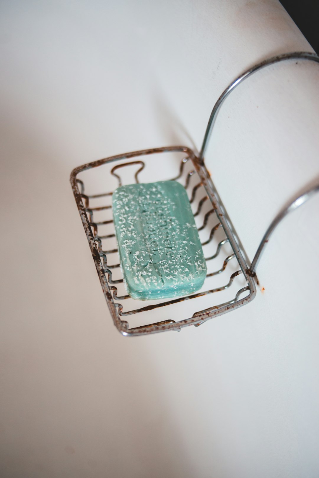 green and white sponge on gray metal rack