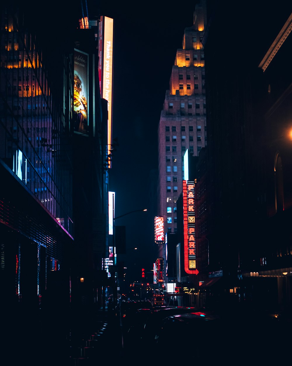 cars on road in city during night time