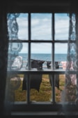 A scenic view of laundry hanging outdoors with clothespins attached.