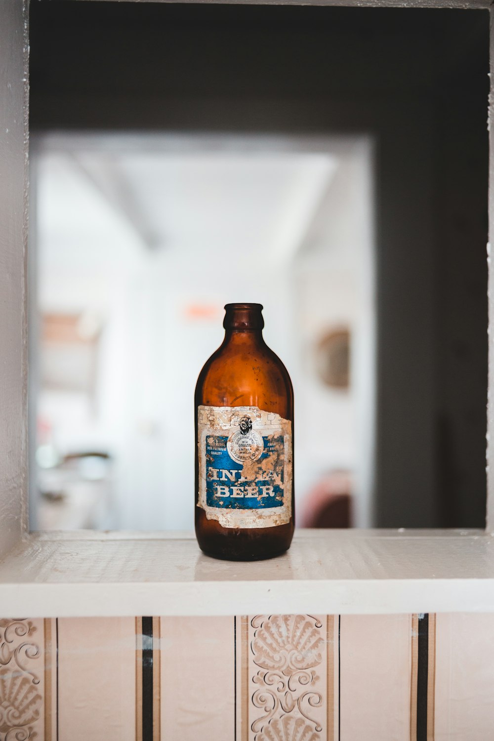 blue labeled bottle on table