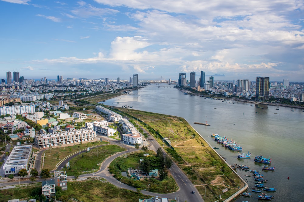 aerial view of city buildings near body of water during daytime