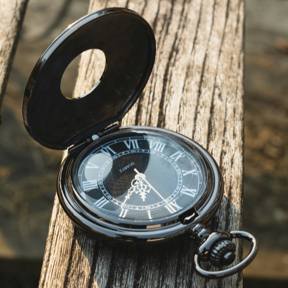 black and silver pocket watch