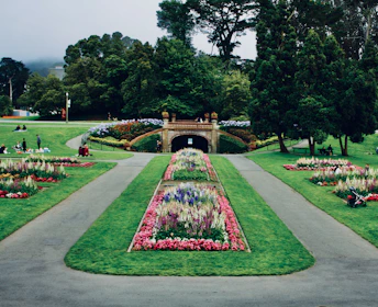 A beautifully landscaped society park with walking paths and benches in Noida.