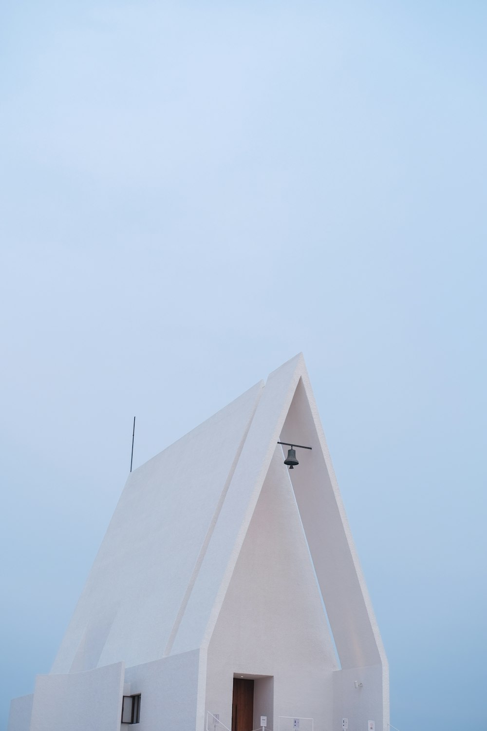 white concrete building under blue sky during daytime