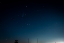 Wide shot of the Kamiya world map with soft gradients of black-blue night sky and scattered stars.