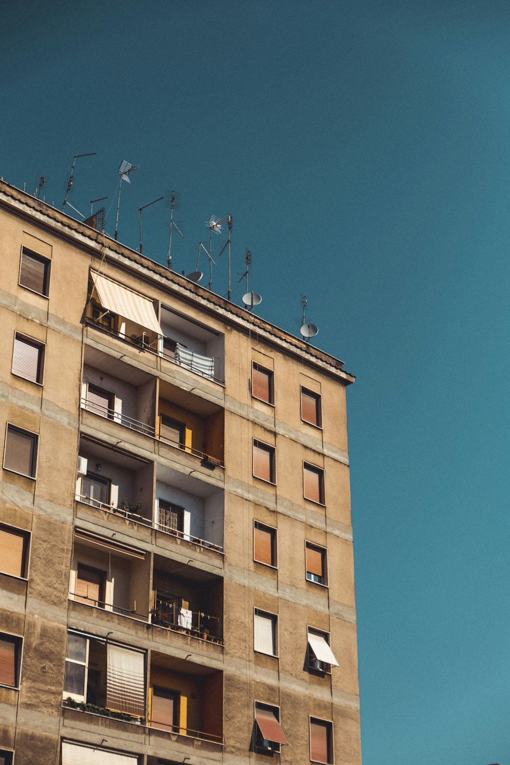 brown concrete building under blue sky during daytime