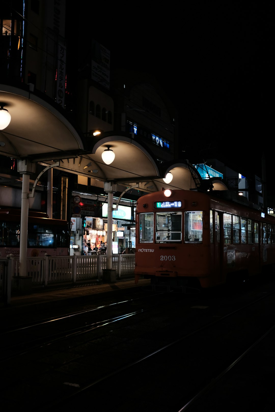 brown and white tram during night time