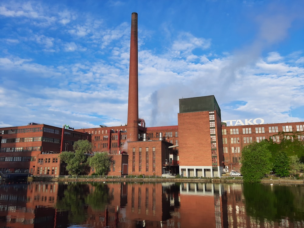 brown concrete building near body of water during daytime