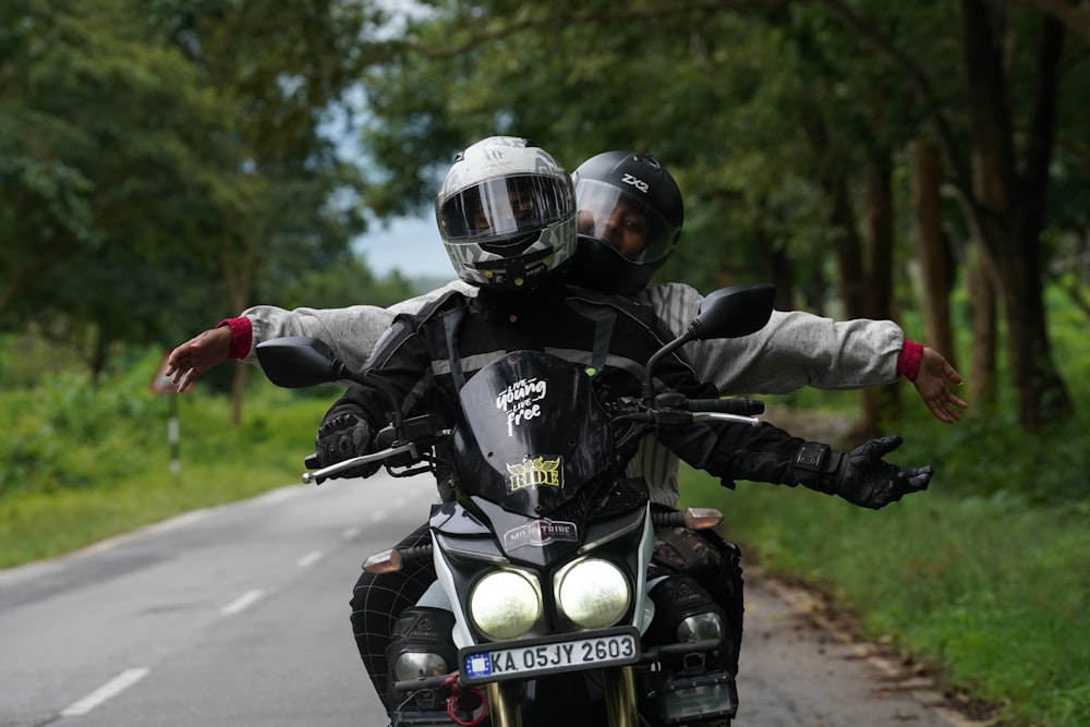 man in black jacket riding motorcycle during daytime