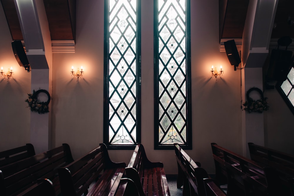 black wooden chairs and table near window