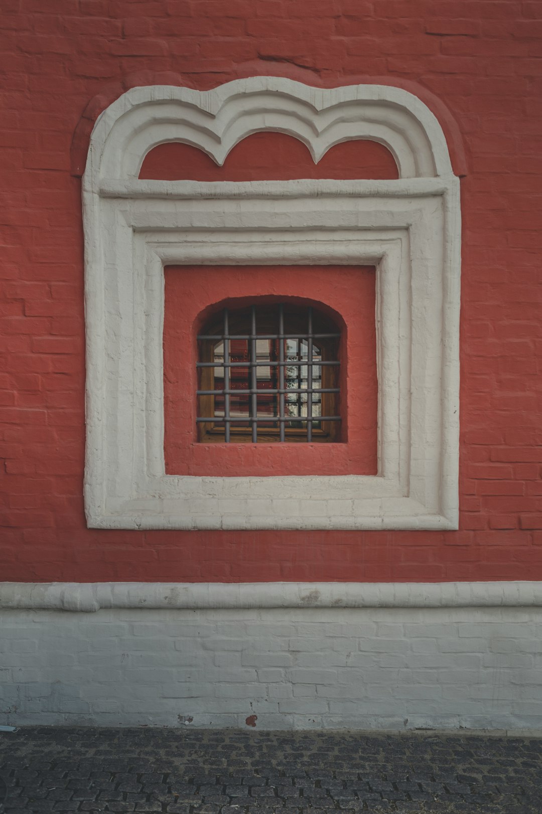 red concrete window frame during daytime