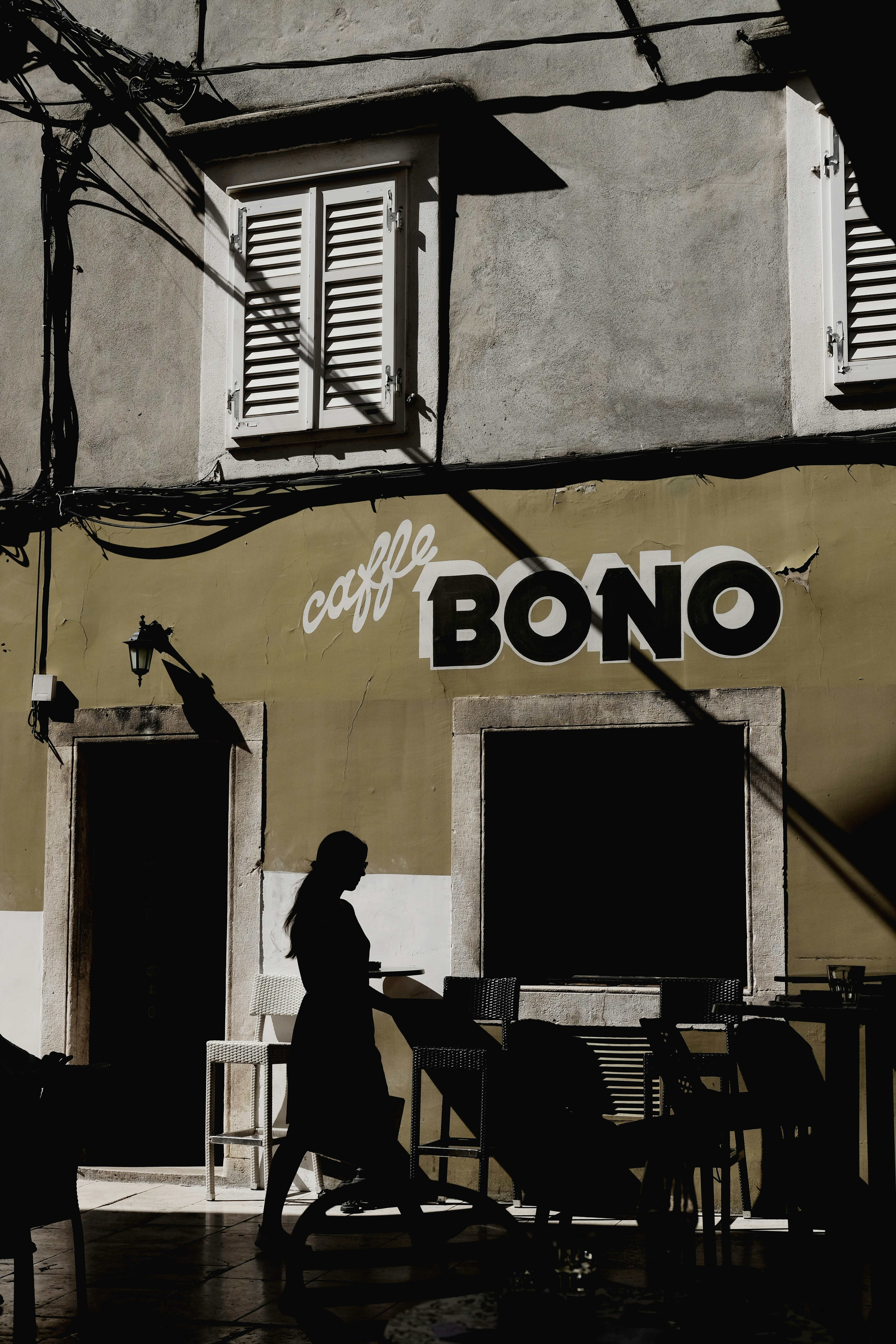 man in black jacket sitting on chair