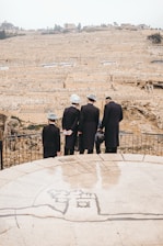 people standing on brown field during daytime