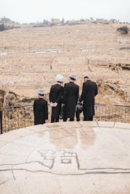 people standing on brown field during daytime