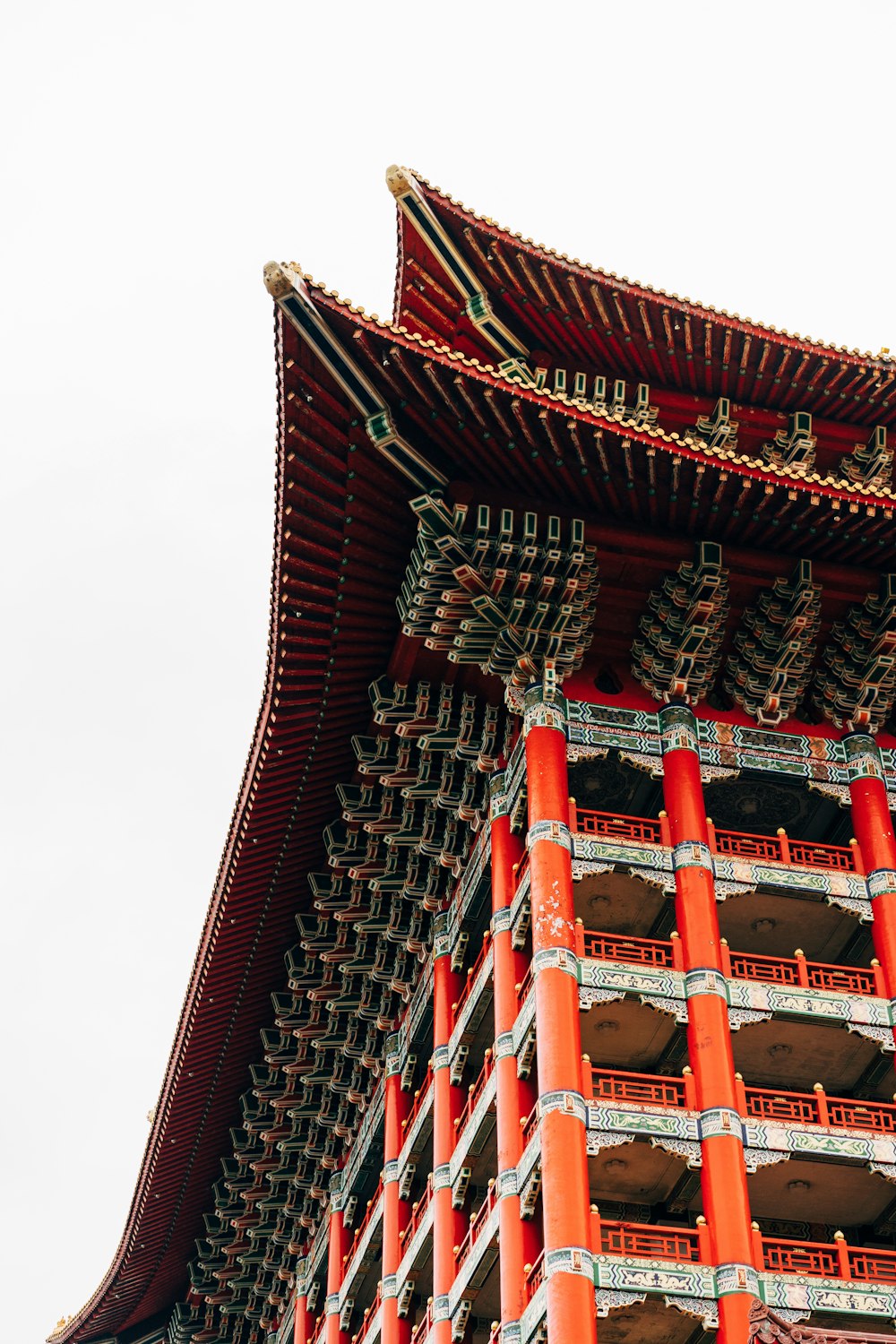 red and white temple under white sky during daytime