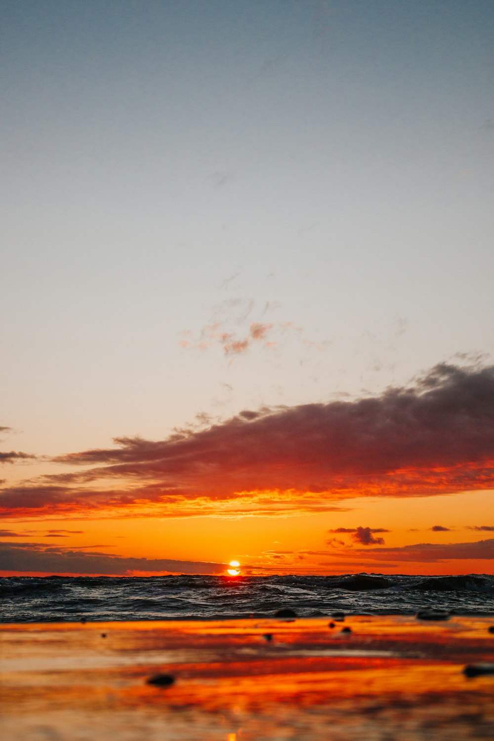 body of water during sunset