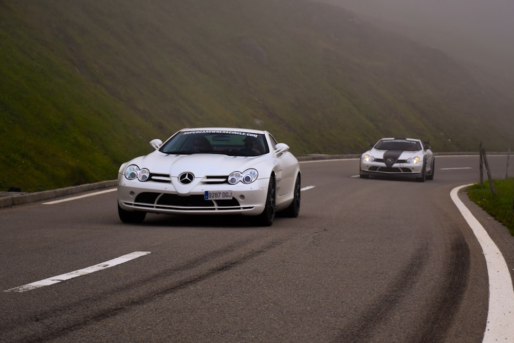 white porsche 911 on road during daytime