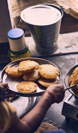 person cooking on black pan