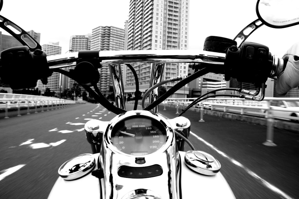 grayscale photo of classic car on road