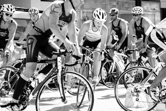 group of men riding on bicycle