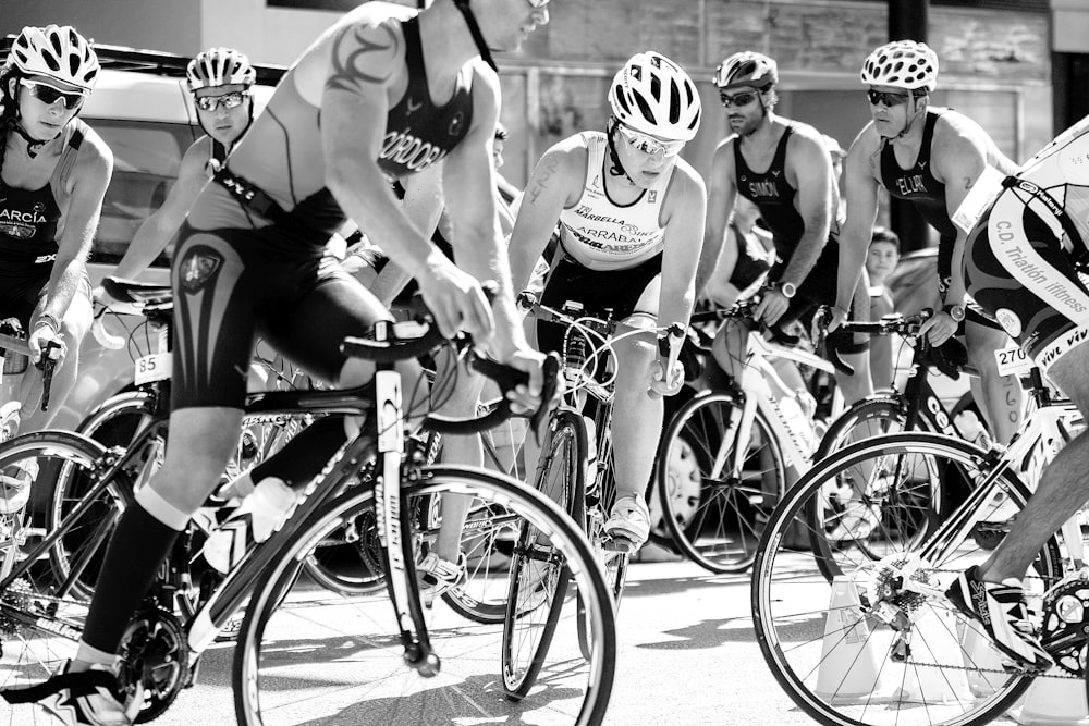 group of men riding on bicycle