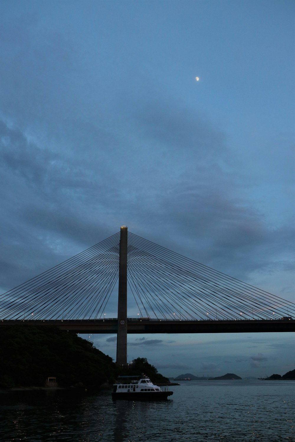 brown bridge under cloudy sky during daytime