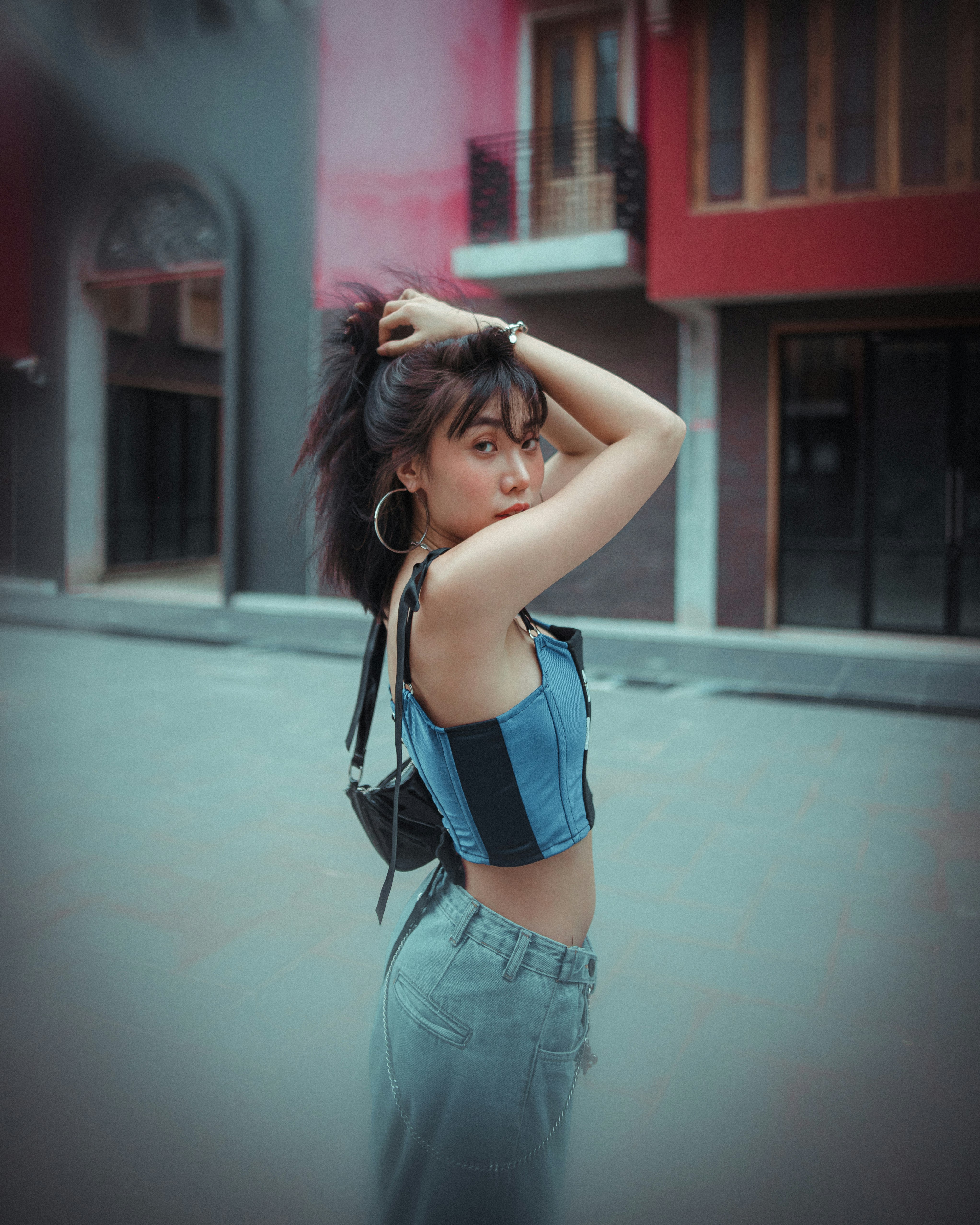 woman in blue tank top and blue denim shorts