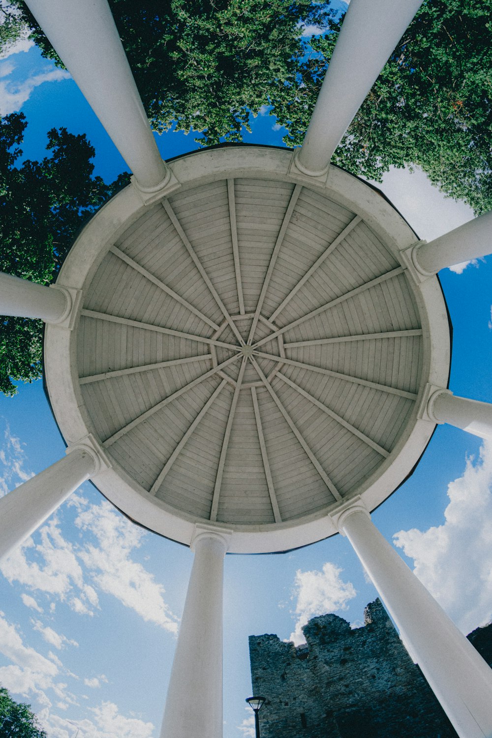 white round concrete building under blue sky during daytime