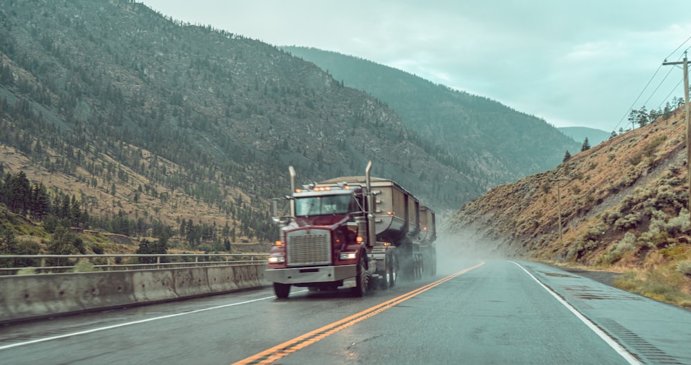 red and white truck on road during daytime