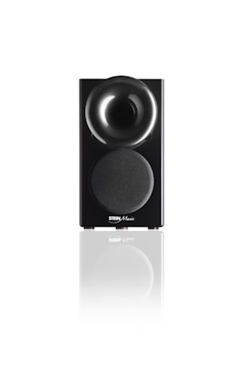 A sleek black speaker with a glossy, rounded top section and a fabric-covered lower section displaying the Stein Music logo. The speaker is reflected on the white surface it stands upon, adding a sense of elegance and modernity.